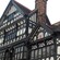 An ornate historic building featuring windows and a crest