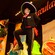 Performers in traditional Mexican attire dance on a stage with a sign that reads Spectaculare hanging above them