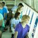 Seated people looking at tropical fish and coral reefs through windows