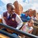 A VIP guide accompanies a young Guest on Big Thunder Mountain Railroad