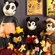 A collection of 7 Mickey Mouse plush toys from different eras under mounted, vintage Mickey publications