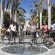 Seven bicyclists wearing helmets pose on their bikes