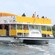 Sightseers on a double deck tour boat sailing through the water