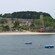 Tethered boats on the water with Monterreal Fortress on shore in the background