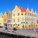 The colonial town of Willemstad in Curacao, Dutch Indies, reveals ornate multi story buildings lining a waterfront