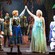 Confetti and snow raining down on a stage of performing Frozen Characters including Anna, Elsa, Olaf and more