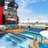 Chairs surrounding a pool on the deck of the Disney Wonder  