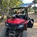 A dune buggy with a helmet on the hood