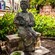 Bronze statue of Felisa Rincón de Gautier in a lush garden
