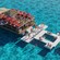 A floating ocean club featuring lounge chairs and a bar in Cozumel, Mexico