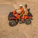 Two Guests riding an ATV off road