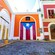 The flag of Puerto Rico painted on the large door of a Spanish Colonial style building