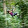 A woman riding a zip line at the Rainforest Adventure Park in Saint Lucia