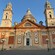 The facade of the Dome of the Basilica of Santa Maria Assunta in Genoa with 2 bell towers and a central dome