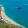A crescent beach along the waters of Sesimbra, Portugal