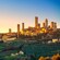 A sunset over San Gimignano's medieval towers atop a hill
