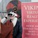 A guide putting a virtual reality headset on a Guest at a Viking museum