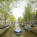 A tour boat navigating the canals of Amsterdam, Netherlands