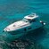 A sleek yacht anchored in the water off the shore of Cozumel