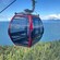 A gondola traveling along a mountainside overlooking Icy Strait Point, Alaska