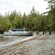 Guests boarding a tour boat moored at a beach on a remote Alaskan island