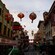 A street in San Francisco's Chinatown with hanging decorative lanterns  