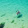 Two people kayaking in the waters of Laguna Del Condado