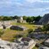 An outdoor plaza filled with ancient Mayan ruins