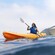 A woman paddling an ocean kayak off the coast of Catalina Island, California.