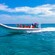 A boat filled with visitors traveling along El Cielo