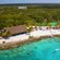 A tropical island with white sand and lush vegetation