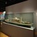 Display cases featuring model ships and artifacts at the Maritime Museum of New Caledonia