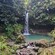 A gentle waterfall feeds a natural bathing pool