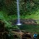 A person admiring Twin Falls in Dominica