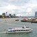 A boat along the Port of Rotterdam with ‘River Cruise Rotterdam’ written on the vessel’s surface