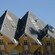 A series of interconnected houses, each shaped like a cube resting on one of its points