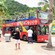 Guests, both inside and outside a sightseeing bus, at the port in Philipsburg, Saint Maarten