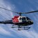 A Helitrans Airbus helicopter flying in the sky