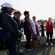 A group of people listen to a tour guide