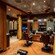 The interior of Hook’s Barbery reveals 2 barber chairs in an upscale barber shop