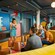 A group of teenagers playing a game of charades inside Vibe, a teen club on board the Disney Adventure