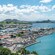 The lush landscape of Saint Martin Island with buildings and mountains