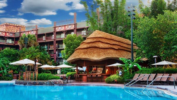 The Uzima Springs Pool Bar at Disney’s Animal Kingdom Lodge and the hotel behind it