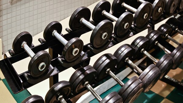 A rack of free weights in the fitness center at Disney's Beach Club Resort in Florida