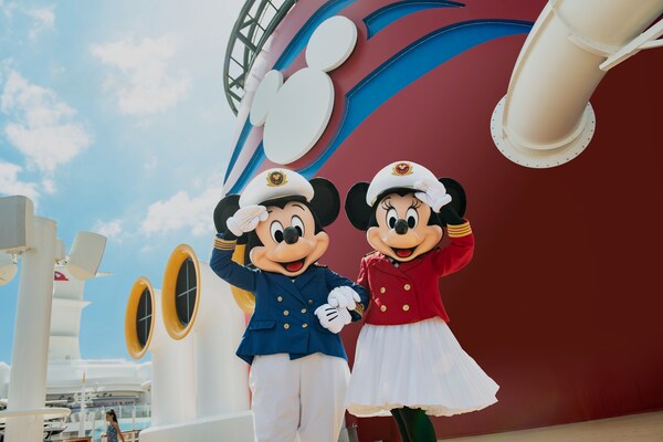 On the deck of a Disney Cruise line ship, Captain Mickey and Captain Minnie stand arm in arm, offering a salute