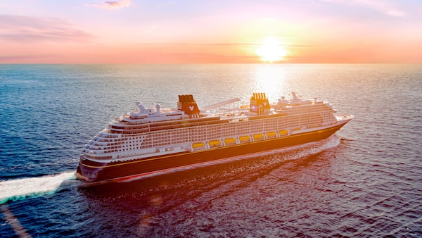The newest Disney Cruise Line ship, the Disney Wish, at sunset