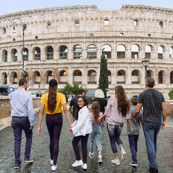 A family walking toward the Colosseum in Rome, Italy