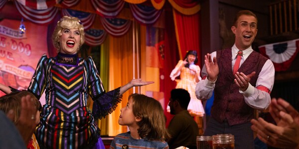 Costumed Cast Members perform as Guests at Hoop Dee Doo Musical Revue look on