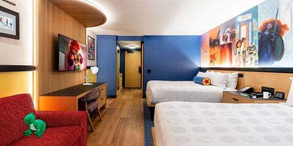 Pixar Place Hotel room with 2 queen size beds and Pixar decorations