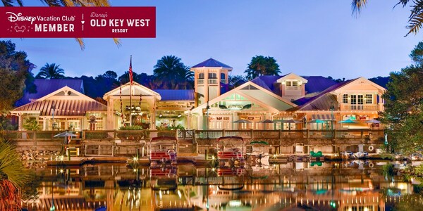 Disney’s Old Key West Resort, with the water in front of it, over which a banner reads, ‘Disney Vacation Club Member, Disney’s Old Key West Resort’